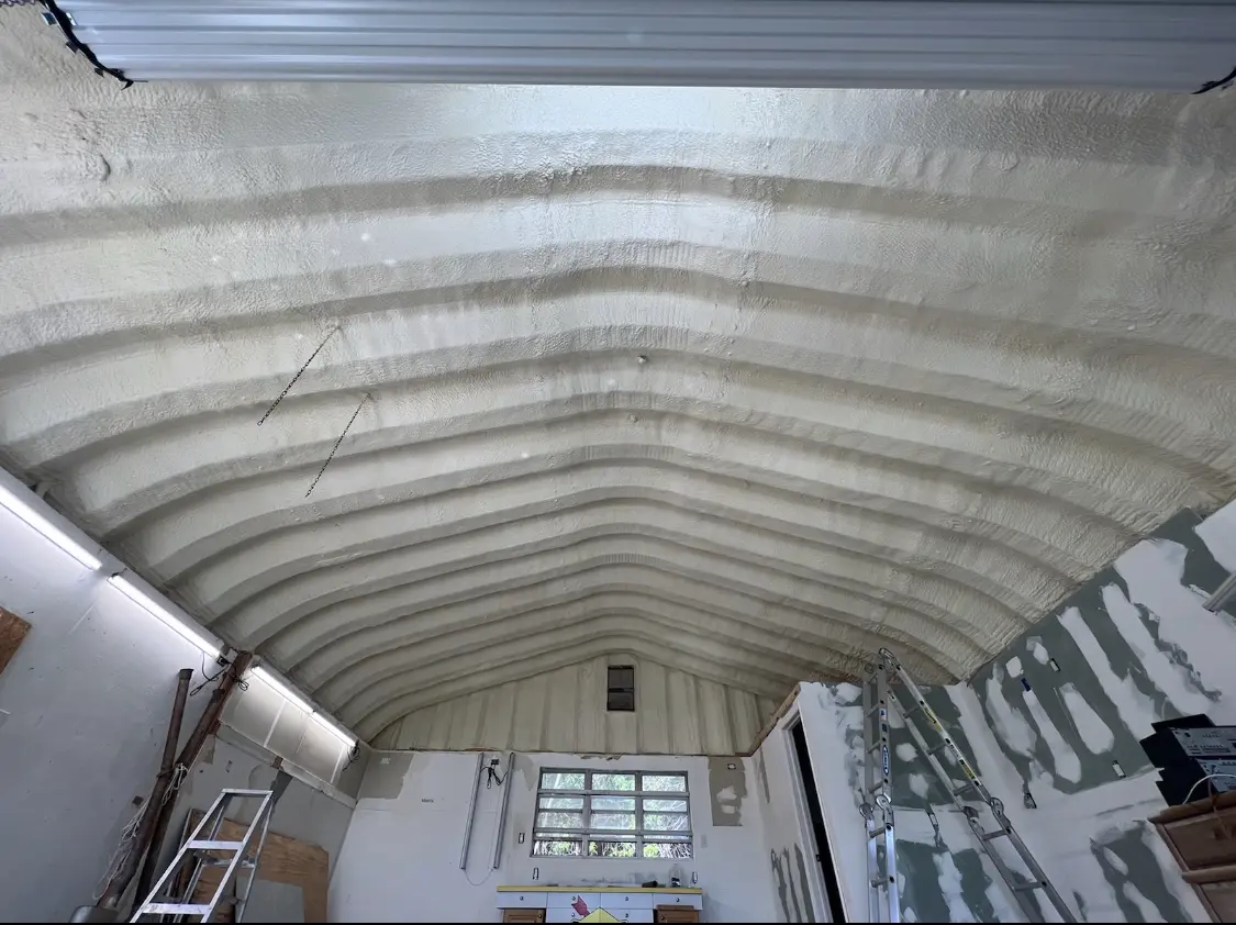 Spray polyurethane foam applied to the underside of a metal roof deck in Eden